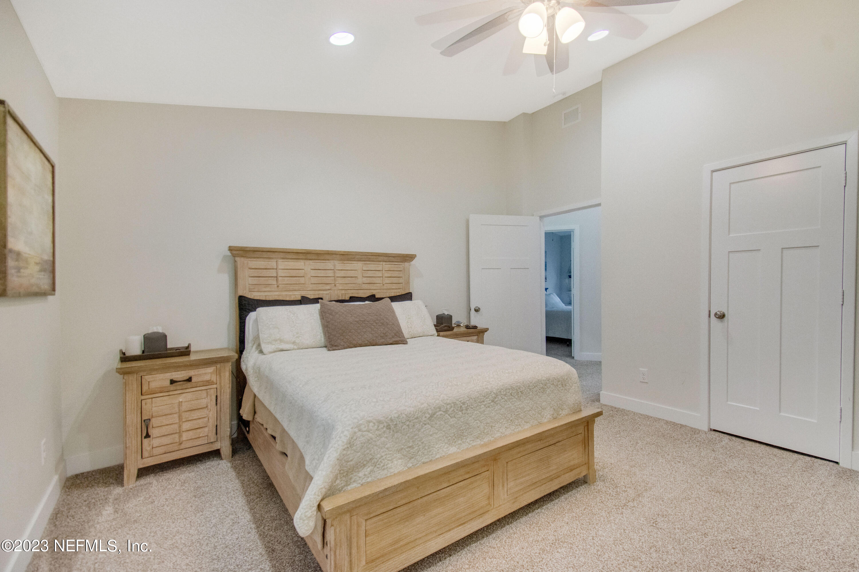 5378 A1A South St. Augustine, FL 32080 - Photo 17 of 34 a bedroom with a bed and a night stand