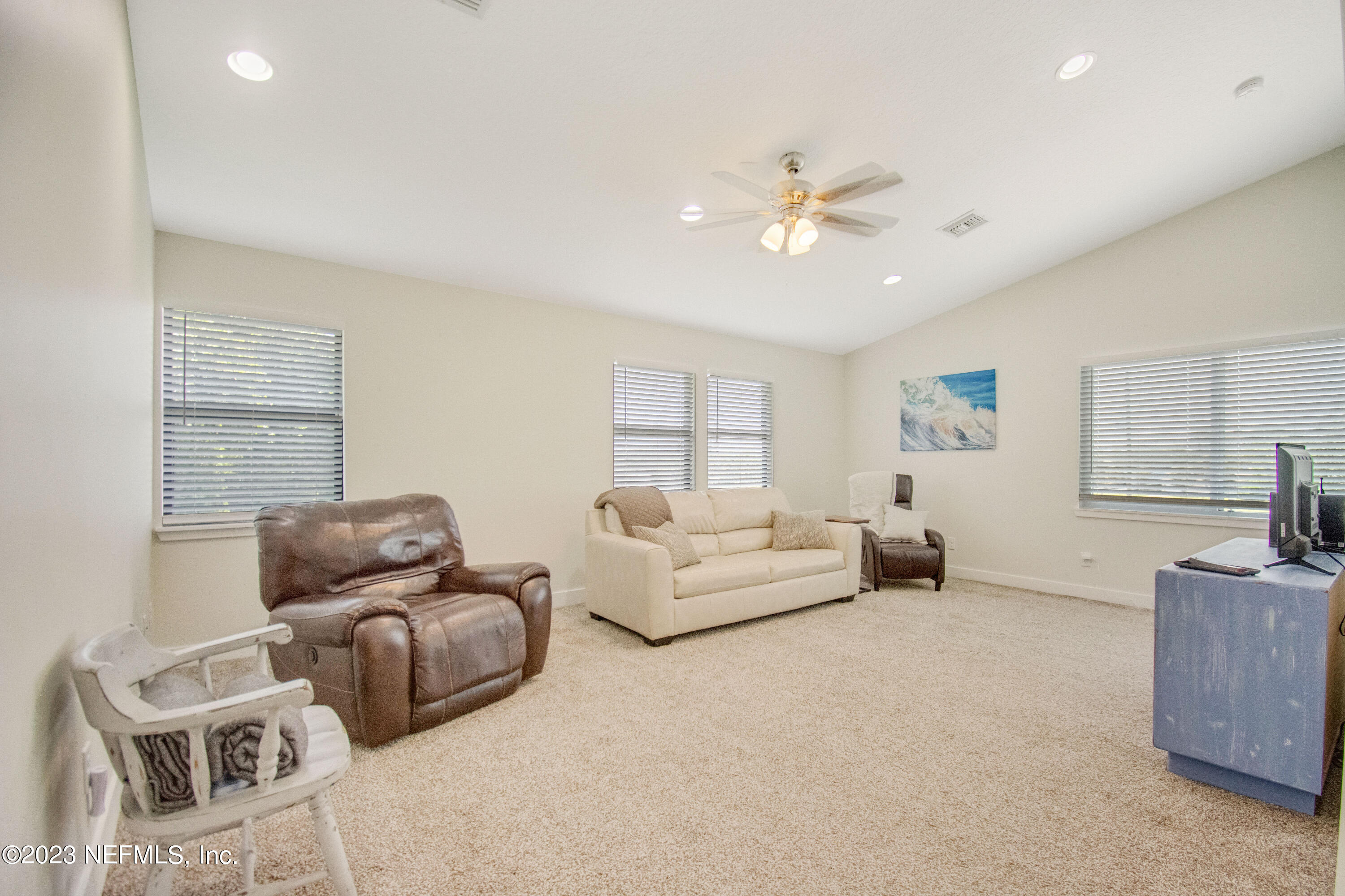 5378 A1A South St. Augustine, FL 32080 - Photo 19 of 34 a living room with furniture and a ceiling fan