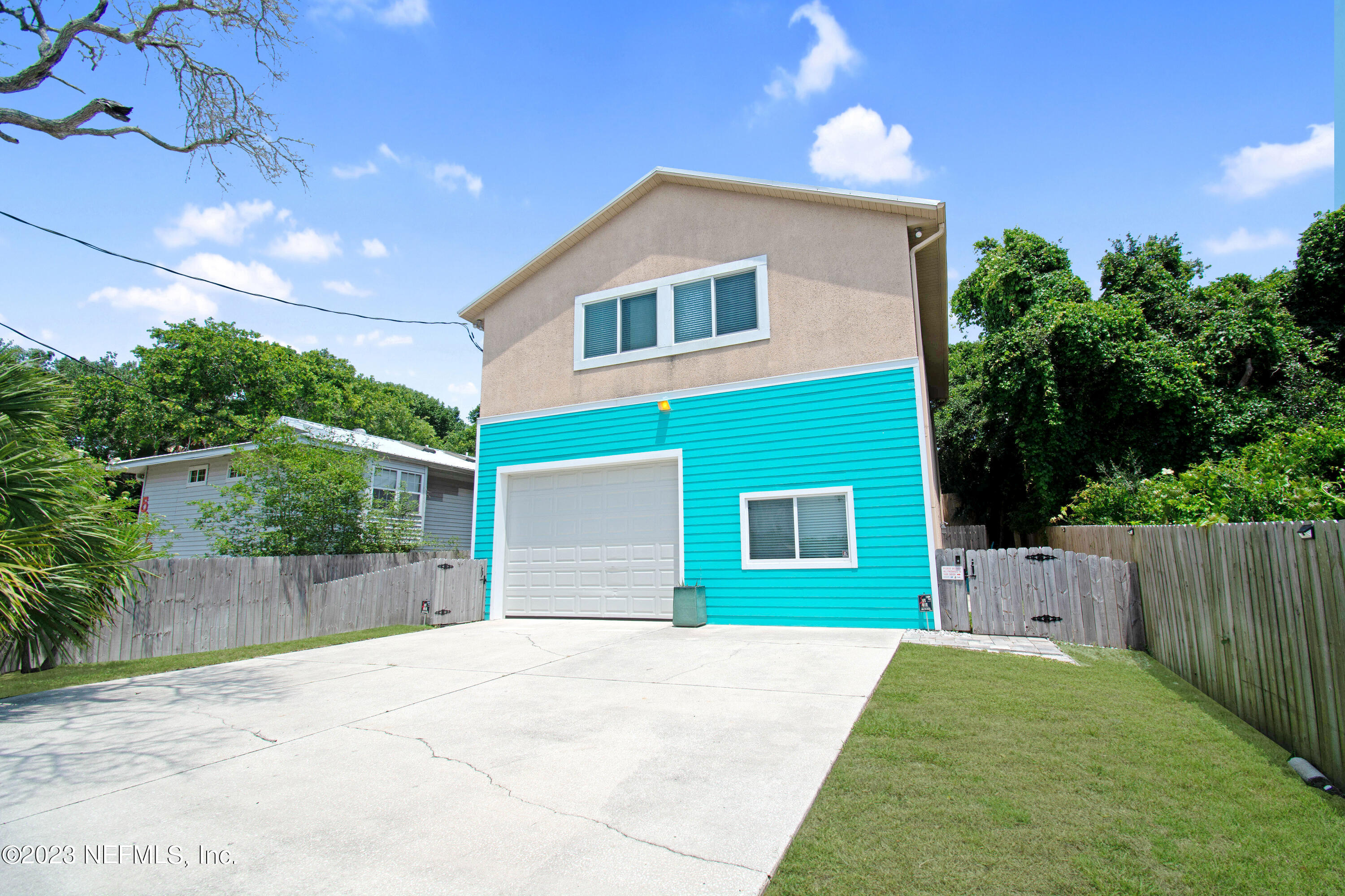 5378 A1A South St. Augustine, FL 32080 - Photo 2 of 34 a front view of a house with a yard and garage