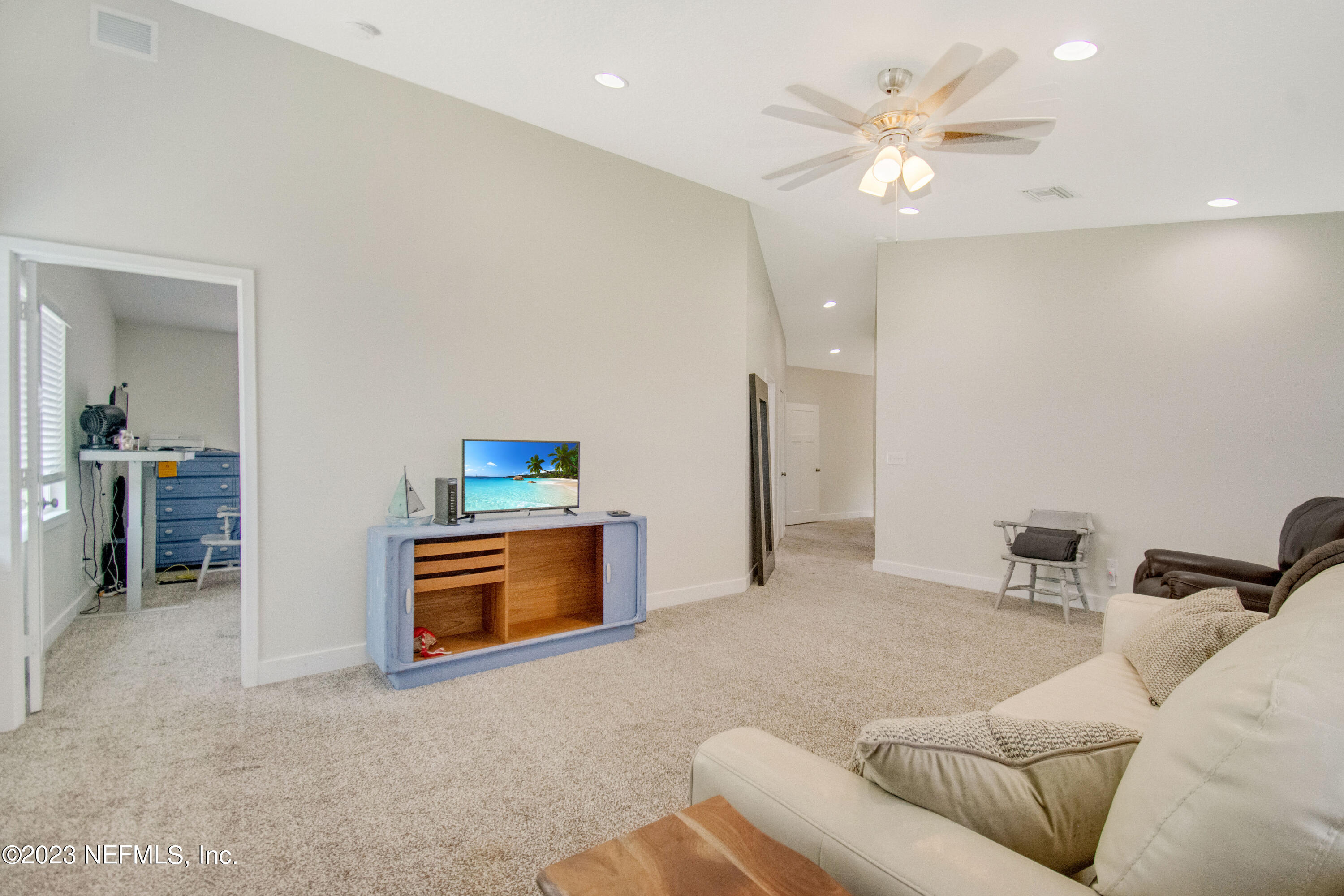5378 A1A South St. Augustine, FL 32080 - Photo 21 of 34 a living room with furniture and a chandelier