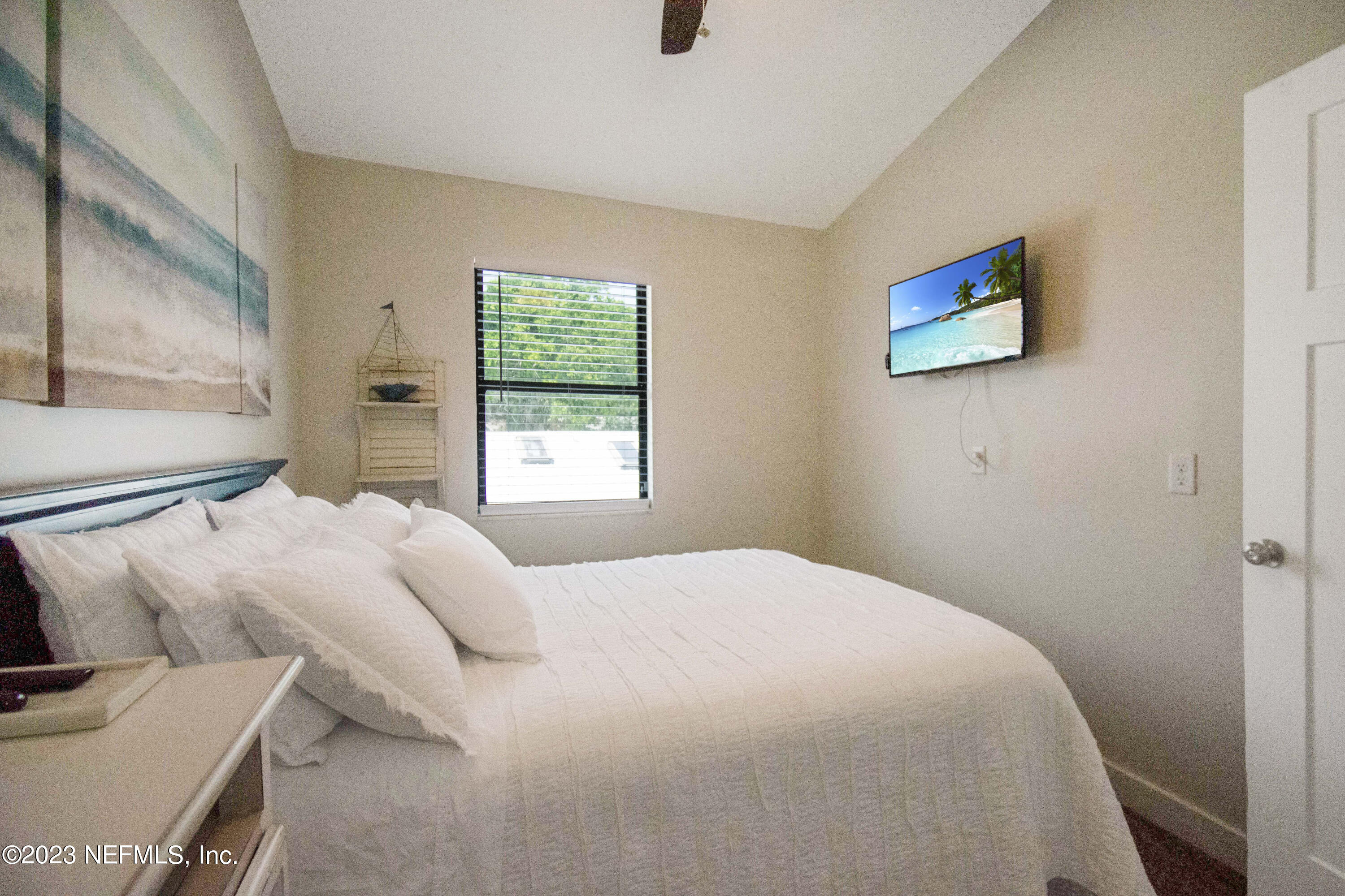 5378 A1A South St. Augustine, FL 32080 - Photo 23 of 34 a bedroom with a bed and a window