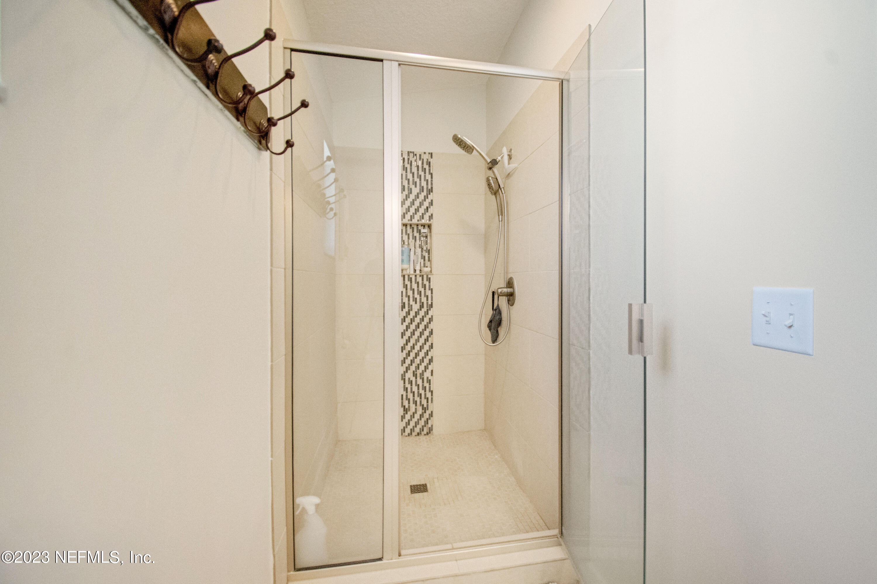 5378 A1A South St. Augustine, FL 32080 - Photo 25 of 34 a bathroom with a glass shower door