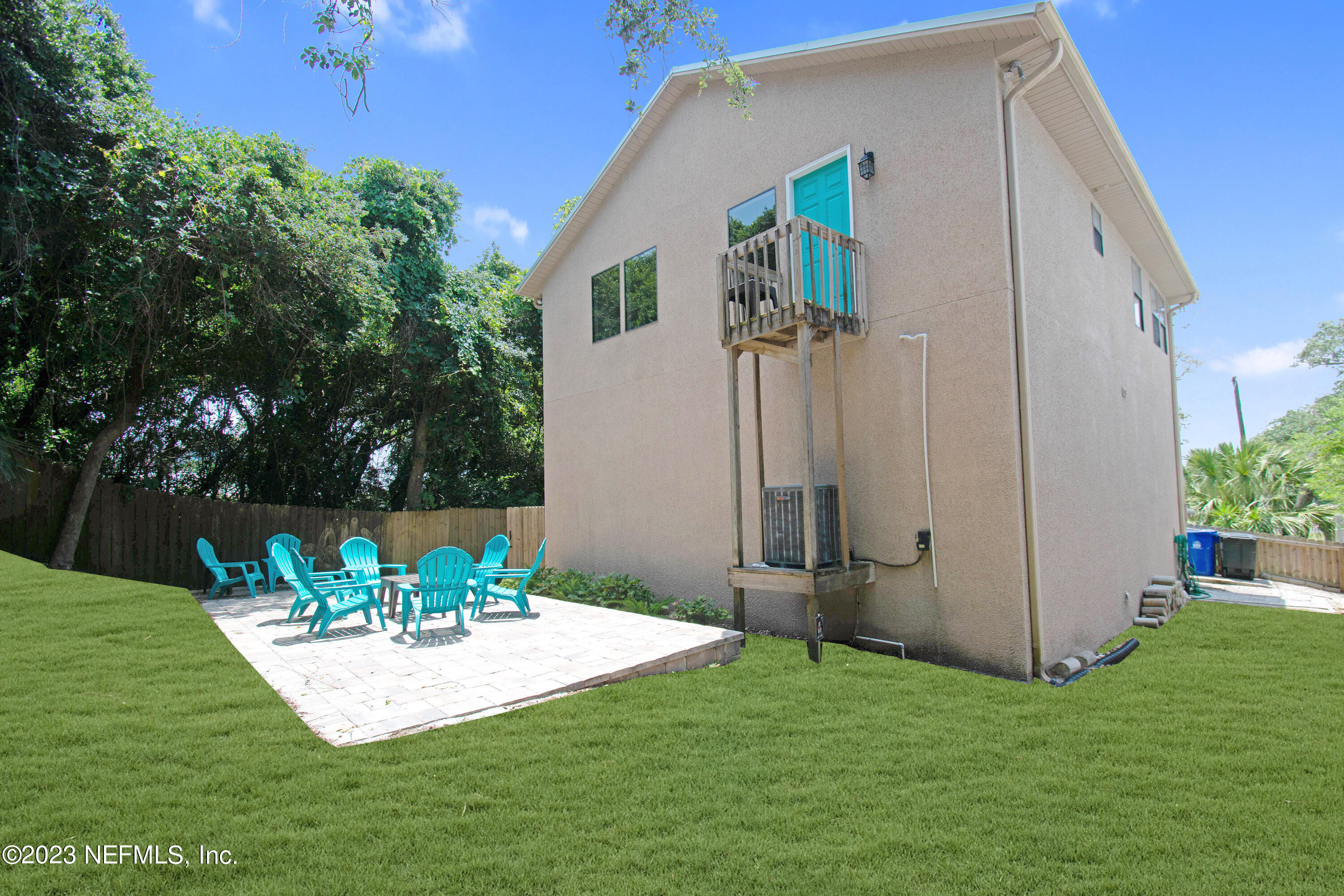 5378 A1A South St. Augustine, FL 32080 - Photo 32 of 34 a backyard of a house with table and chairs
