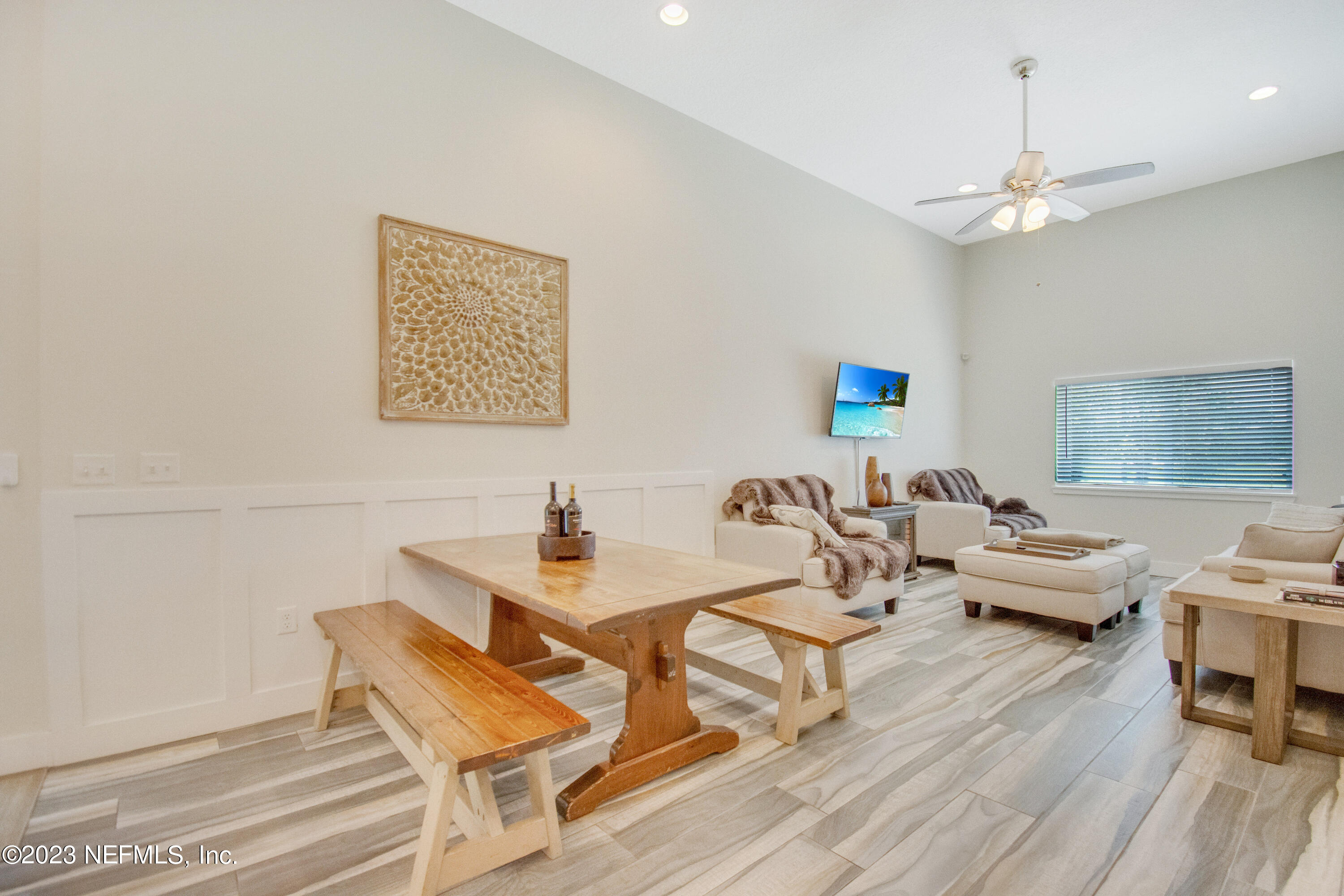 5378 A1A South St. Augustine, FL 32080 - Photo 9 of 34 a living room with patio furniture and a chandelier