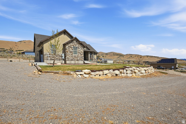 1588 West Rim Rock Drive Stockton, UT 84071 - Photo 47 of 61 Contemporary ranch-style residence featuring a combination of stucco and stone veneer exterior