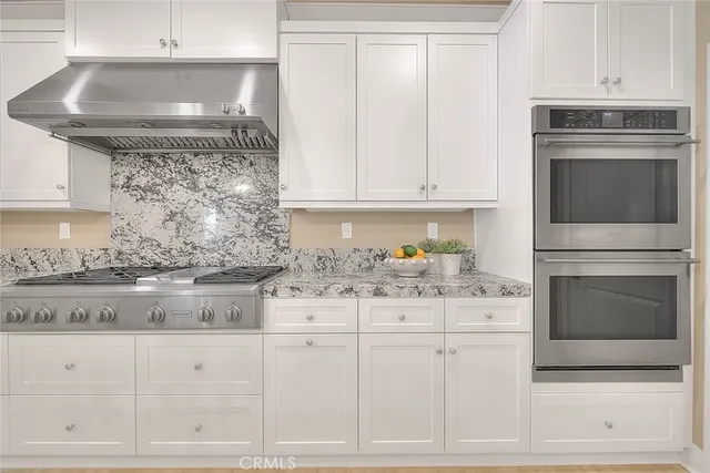 a bedroom with a bed and a lamp