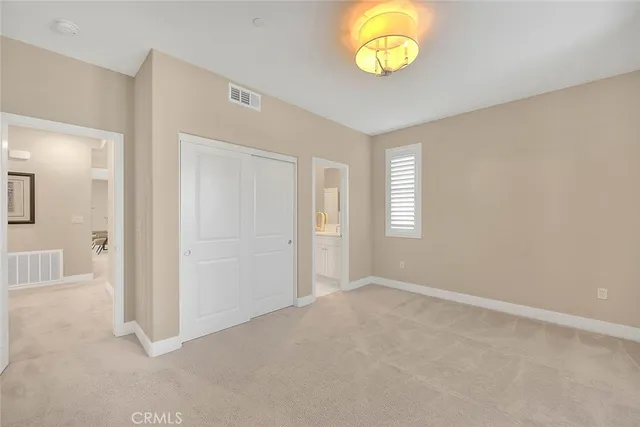 a living room with furniture and a pool table