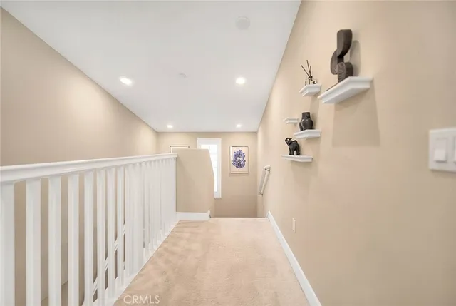 an aerial view of a house with swimming pool and mountains