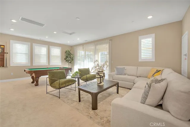 an aerial view of residential houses with outdoor space and lake view