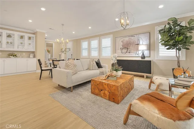 a kitchen with kitchen island granite countertop a sink cabinets and stainless steel appliances