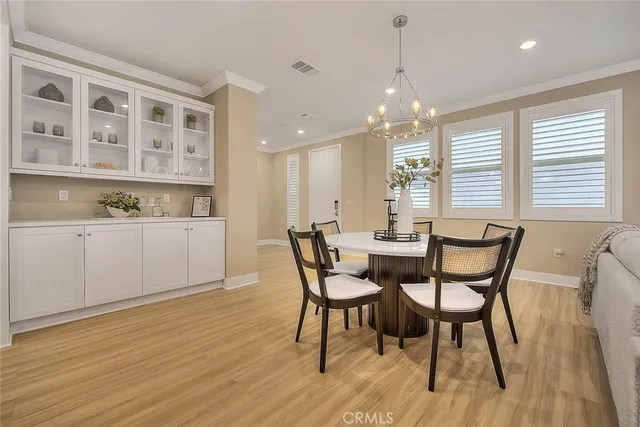 a kitchen with a table and chairs in it
