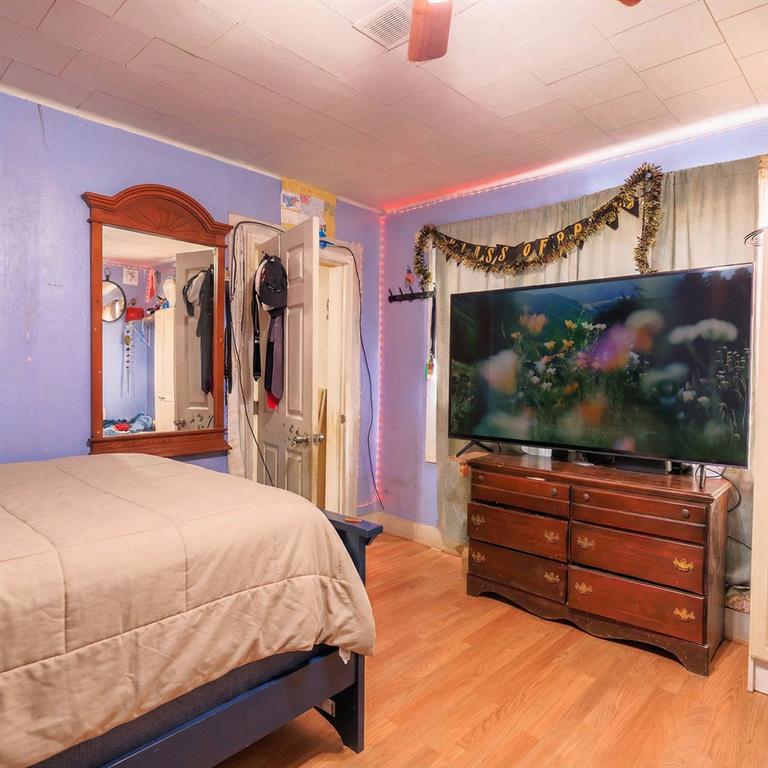 241 East Killian Street Canton, GA 30114 - Photo 11 of 15 a bedroom with a bed and a flat screen tv