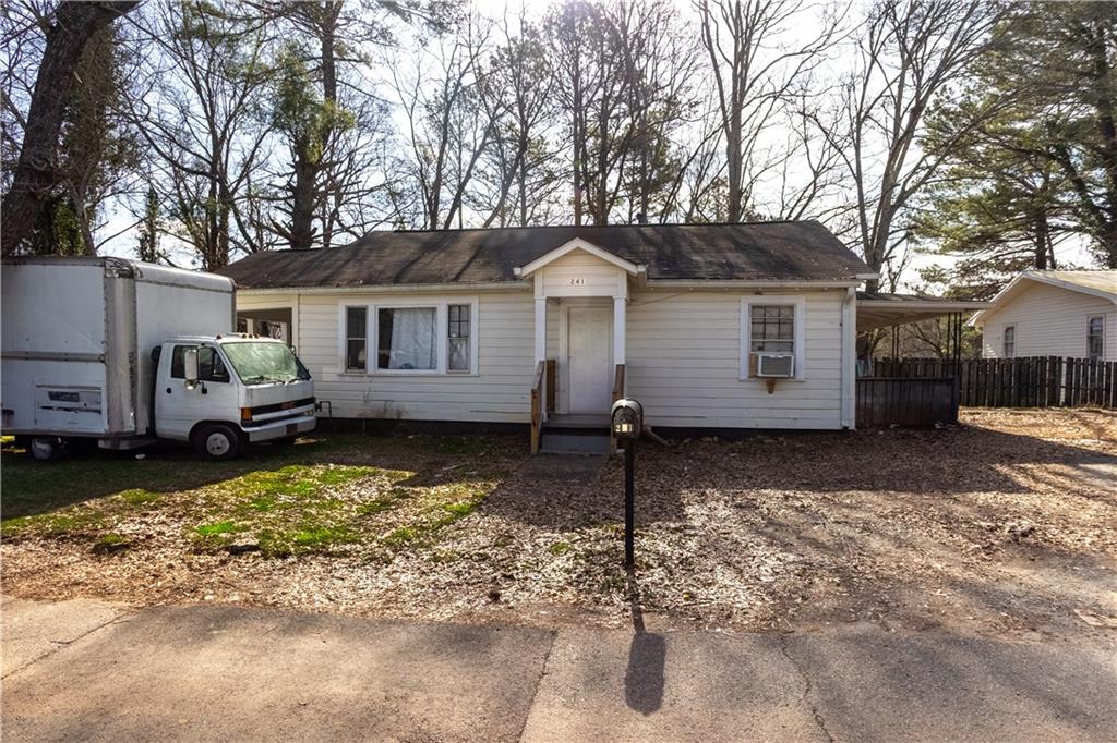 241 East Killian Street Canton, GA 30114 - Photo 15 of 15 a view of a house with a yard covered in snow