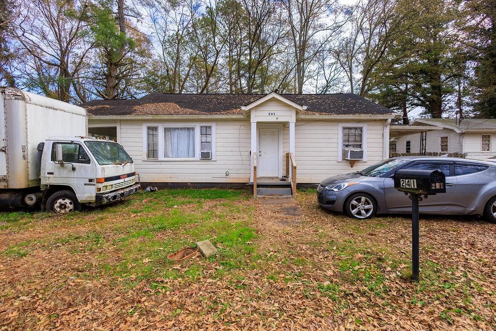 241 East Killian Street Canton, GA 30114 - Photo 2 of 15 a view of a car in front of house
