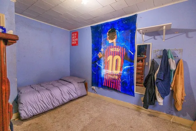 a bedroom with a bed and a walk in closet