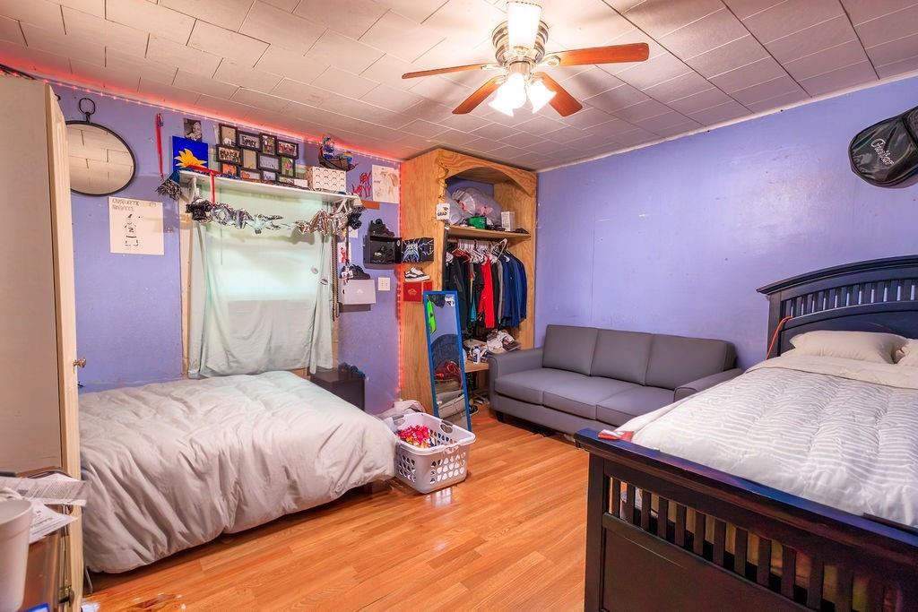 241 East Killian Street Canton, GA 30114 - Photo 10 of 15 a bedroom with bed and a chandelier