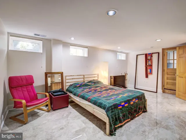 a view of backyard with outdoor seating a patio and plants