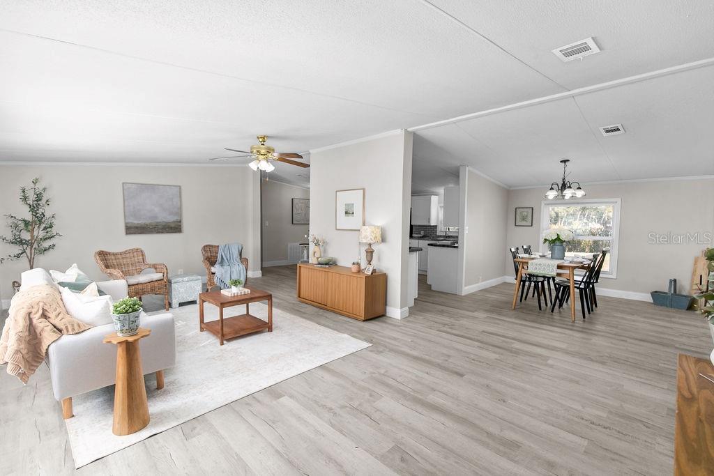 18137 Hollister Road Orlando, FL 32820 - Photo 2 of 27 a living room with furniture and wooden floor