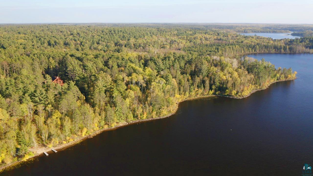 7236 Far North Road Orr, MN 55771 - Photo 2 of 42 View of property location with a heavily wooded area and a nearby body of water