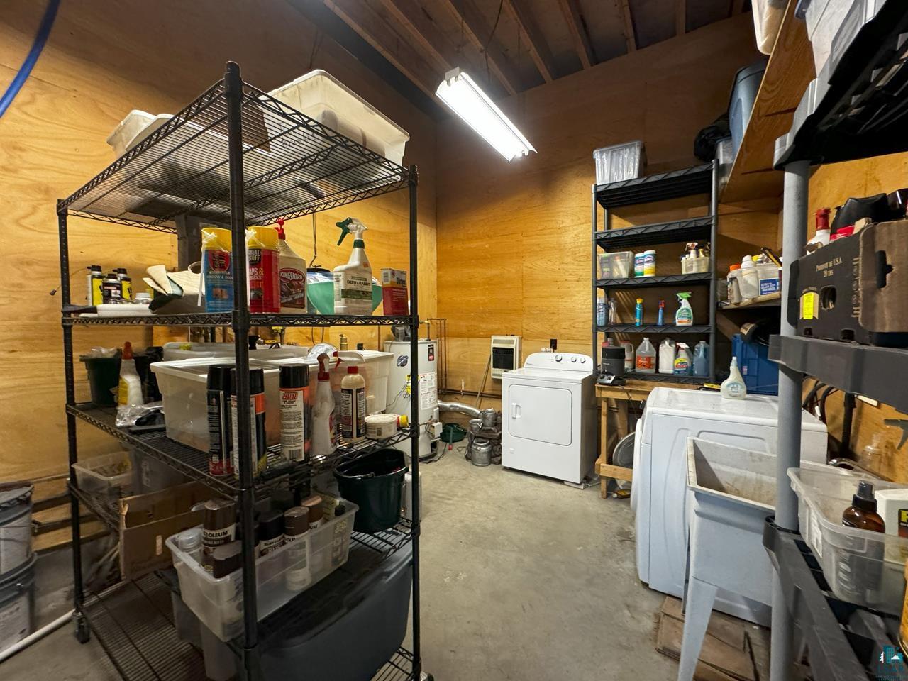 7236 Far North Road Orr, MN 55771 - Photo 33 of 42 Storage featuring washing machine and clothes dryer and water heater