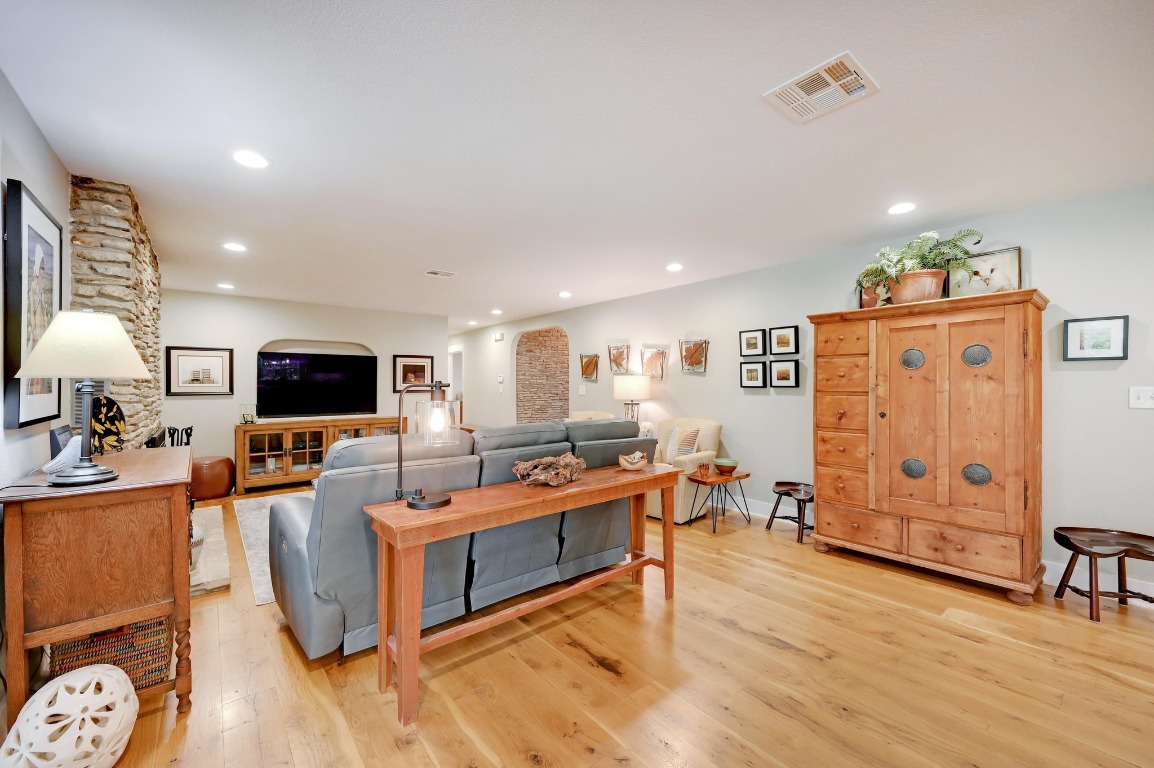 1020 River Road Wimberley, TX 78676 - Photo 11 of 40 a living room with furniture and a flat screen tv