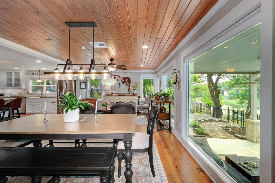1020 River Road Wimberley, TX 78676 - Photo 15 of 40 a view of a dining room with furniture window and outside view