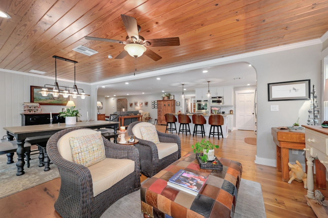 1020 River Road Wimberley, TX 78676 - Photo 17 of 40 a living room with furniture and a chandelier