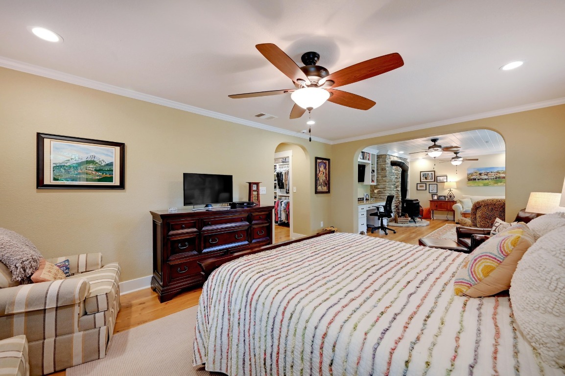 1020 River Road Wimberley, TX 78676 - Photo 20 of 40 a bedroom with a bed and a flat screen tv