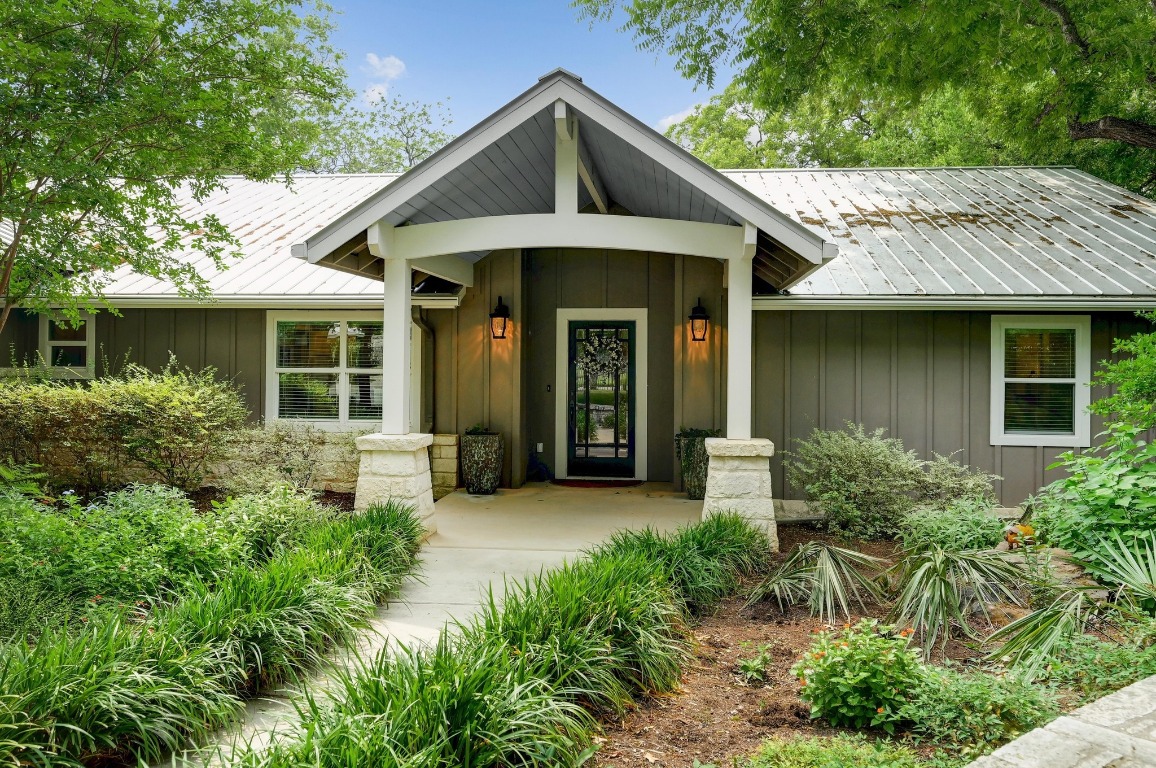 1020 River Road Wimberley, TX 78676 - Photo 38 of 40 a front view of a house with garden