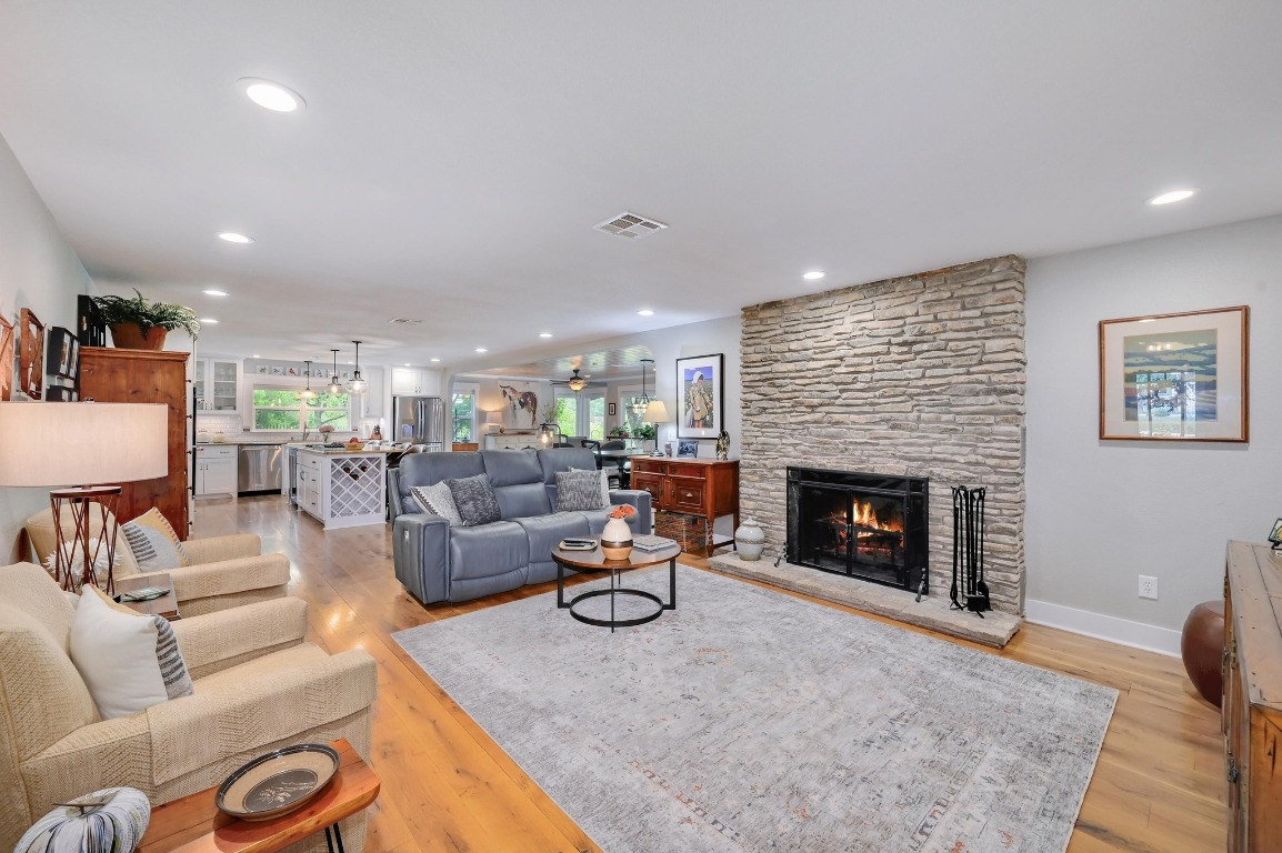 1020 River Road Wimberley, TX 78676 - Photo 6 of 40 a living room with furniture and a fireplace