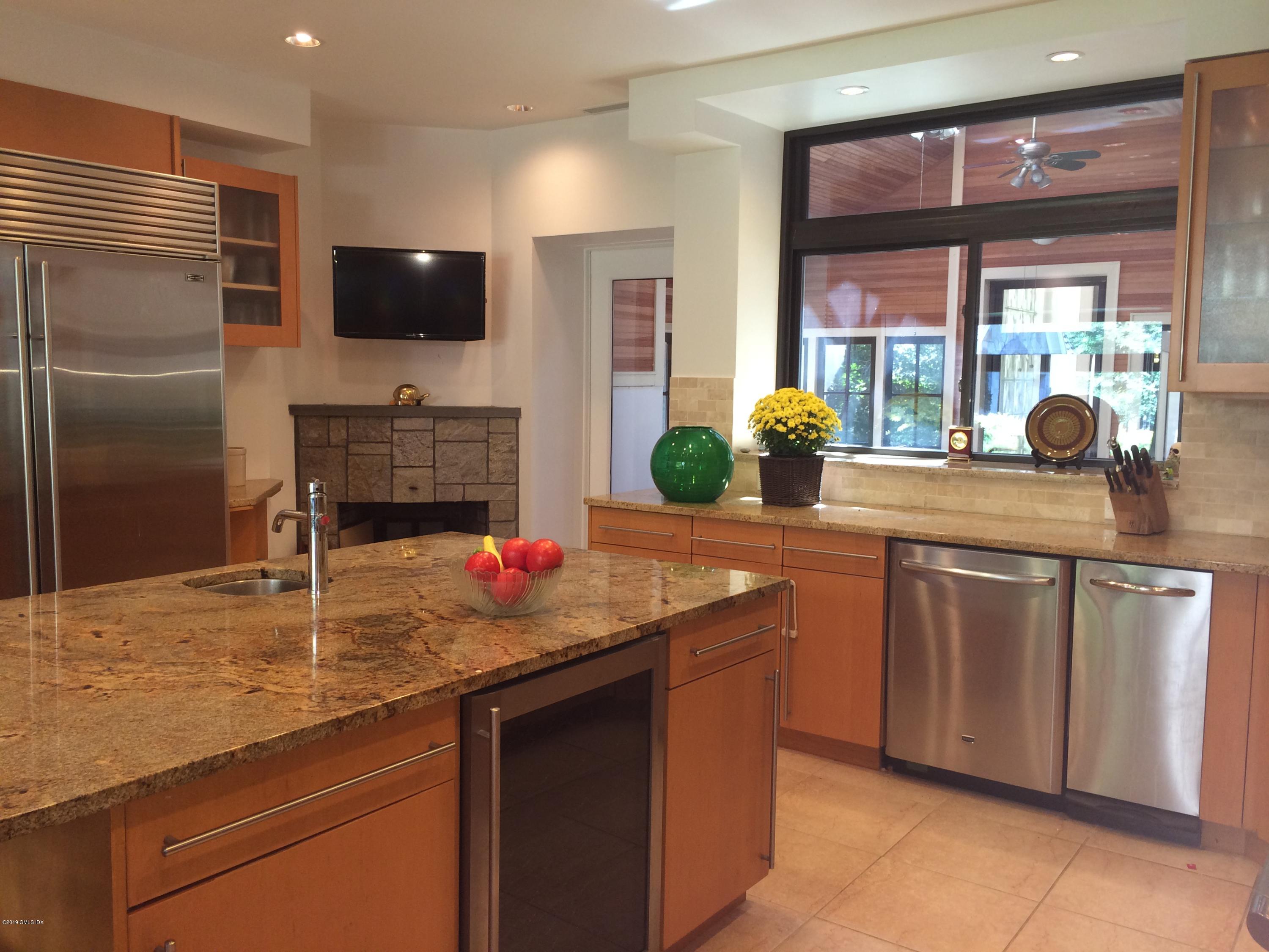 17 Heronvue Road Greenwich, CT 06831 - Photo 13 of 31 a kitchen with stainless steel appliances granite countertop a sink a stove and a refrigerator