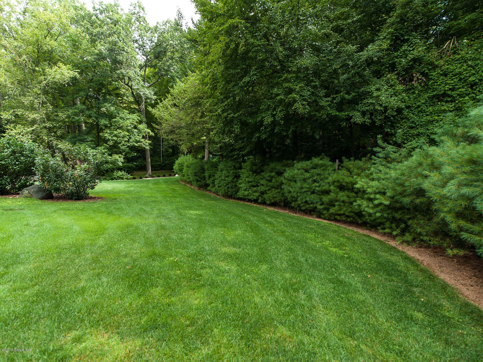 17 Heronvue Road Greenwich, CT 06831 - Photo 23 of 31 a view of a yard with a trees
