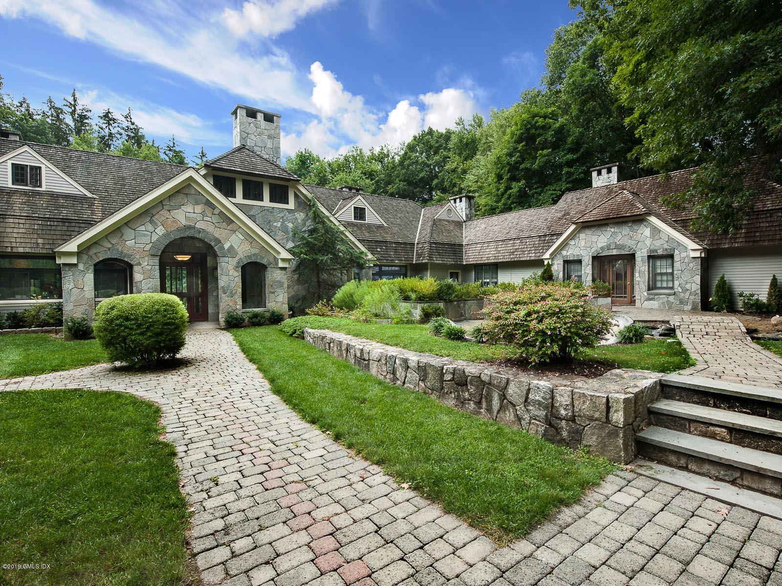 17 Heronvue Road Greenwich, CT 06831 - Photo 26 of 31 a front view of a house with a yard