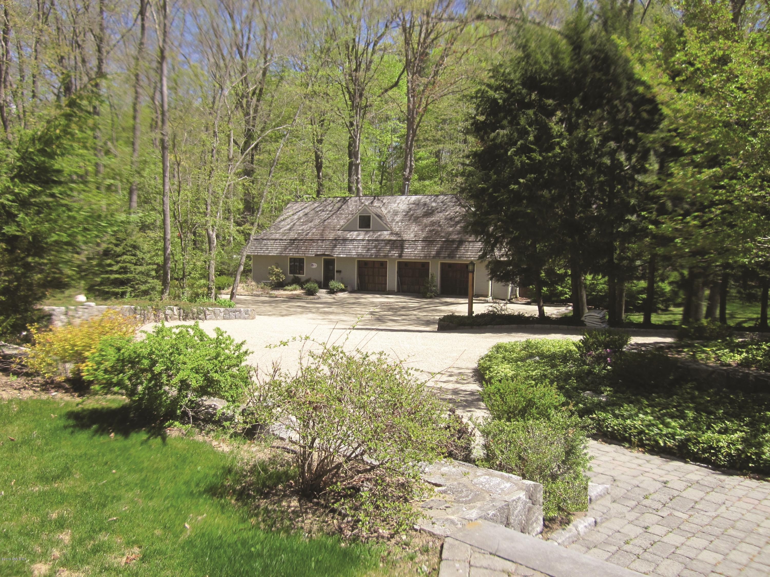 17 Heronvue Road Greenwich, CT 06831 - Photo 27 of 31 a view of swimming pool with lawn chairs and plants