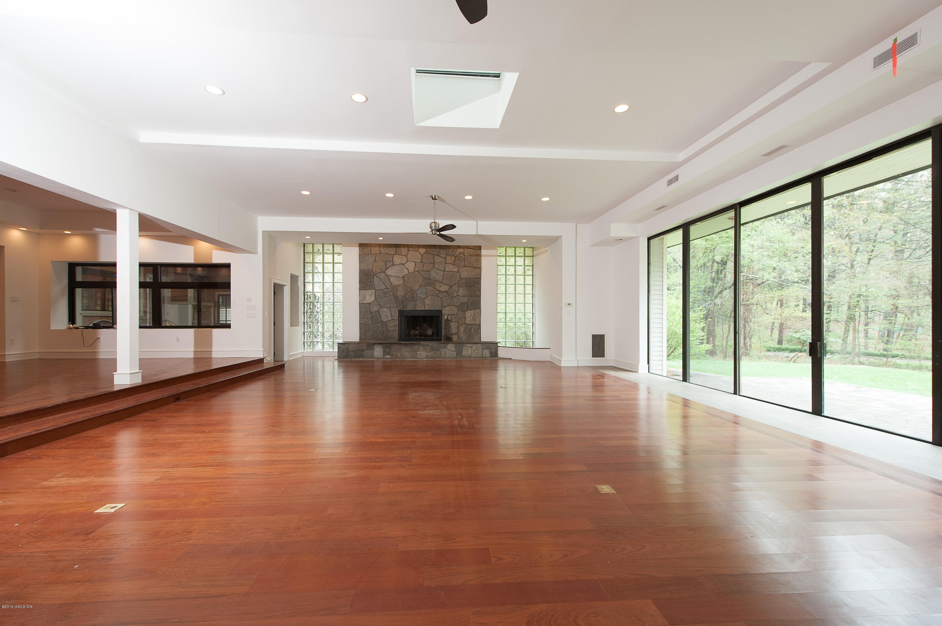 17 Heronvue Road Greenwich, CT 06831 - Photo 5 of 31 a view of an empty room with wooden floor and a window