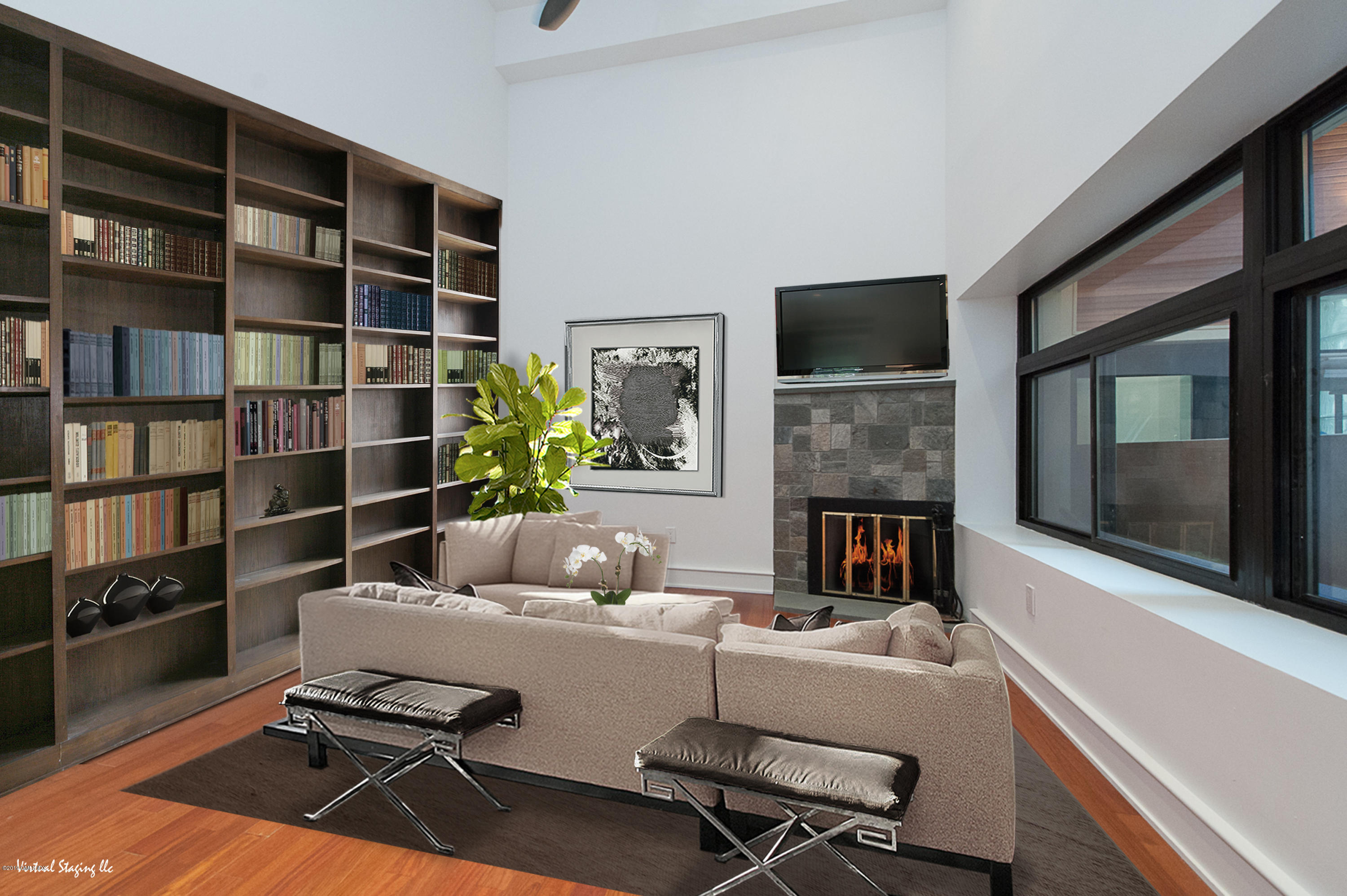 17 Heronvue Road Greenwich, CT 06831 - Photo 10 of 31 a living room with furniture a flat screen tv and a fireplace