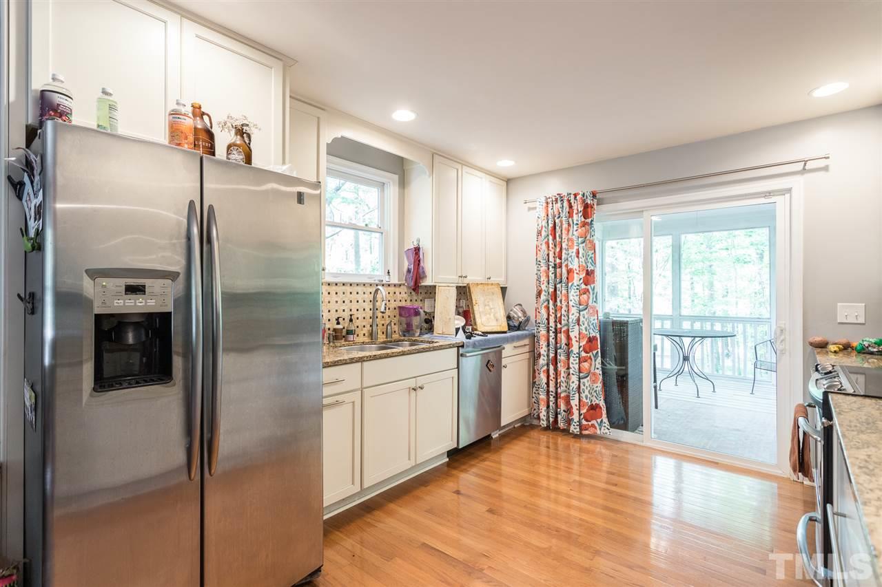 7535 Mine Valley Road Raleigh, NC 27615 - Photo 11 of 26 a kitchen with stainless steel appliances granite countertop a refrigerator and a sink