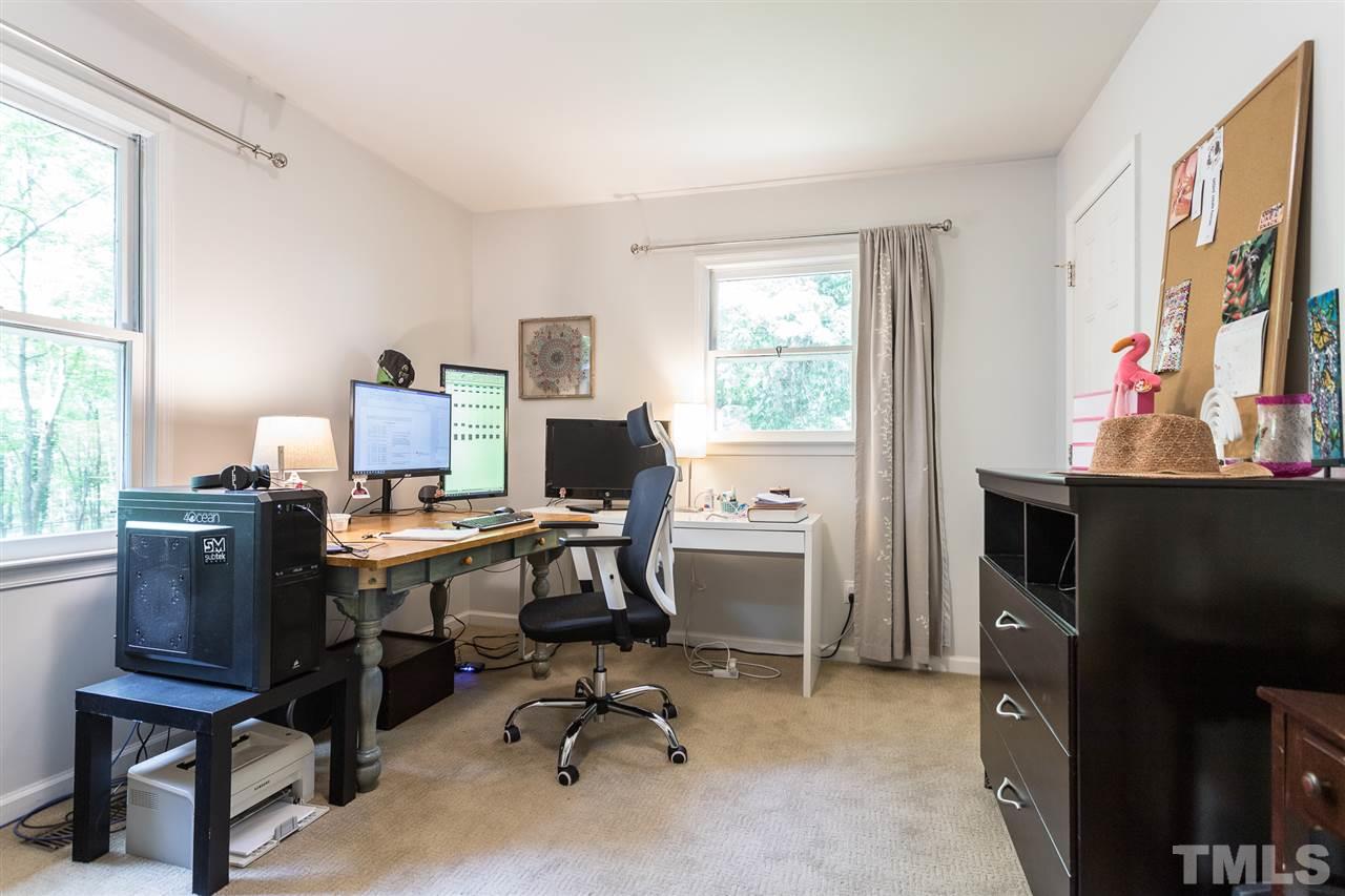 7535 Mine Valley Road Raleigh, NC 27615 - Photo 15 of 26 a view of a workspace with furniture and a window