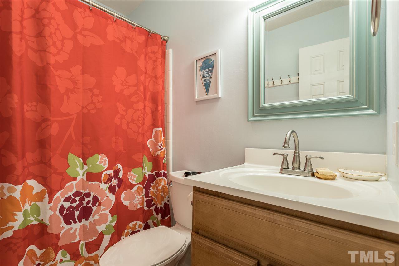 7535 Mine Valley Road Raleigh, NC 27615 - Photo 16 of 26 a bathroom with a sink and a mirror