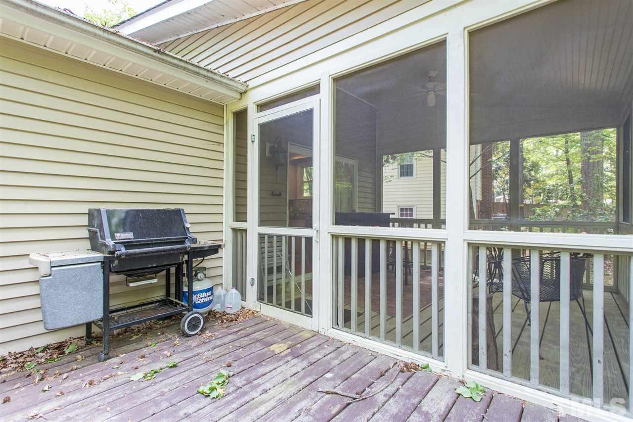 7535 Mine Valley Road Raleigh, NC 27615 - Photo 21 of 26 a view of a balcony with chair and wooden floor