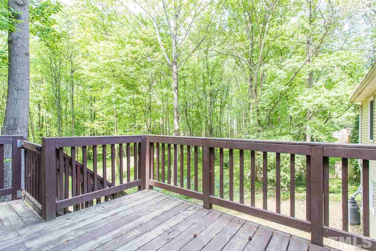 7535 Mine Valley Road Raleigh, NC 27615 - Photo 22 of 26 a view of balcony with wooden floor and fence