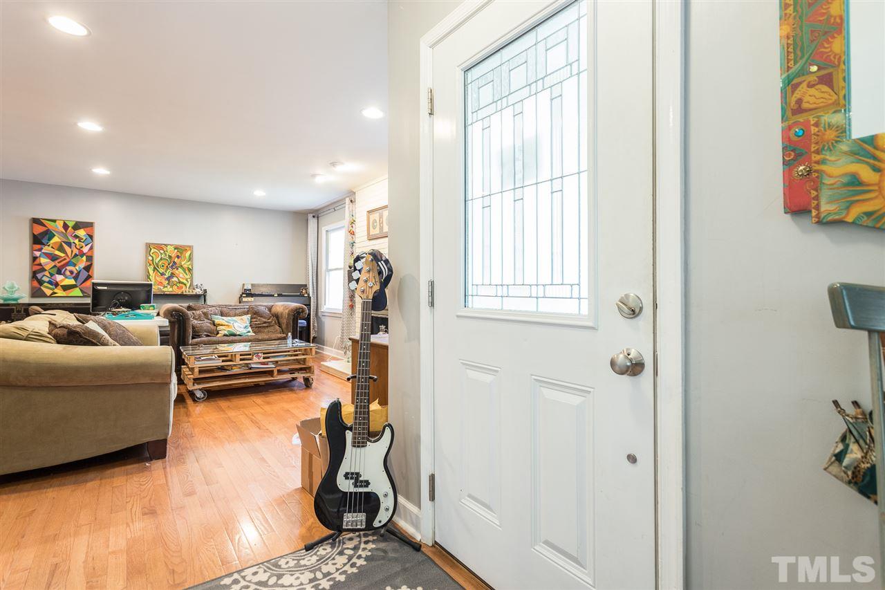 7535 Mine Valley Road Raleigh, NC 27615 - Photo 5 of 26 a living room with furniture a couch and a window
