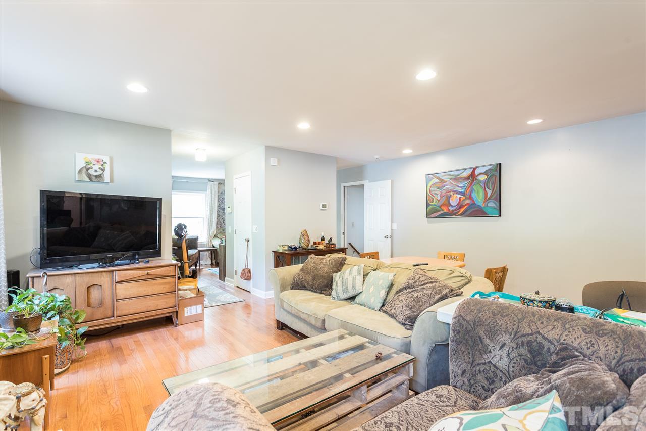 7535 Mine Valley Road Raleigh, NC 27615 - Photo 6 of 26 a living room with furniture and a flat screen tv