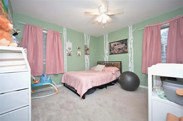 a bed room with a bed and a mirror