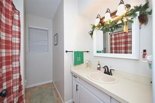 a living room with furniture and a work place area