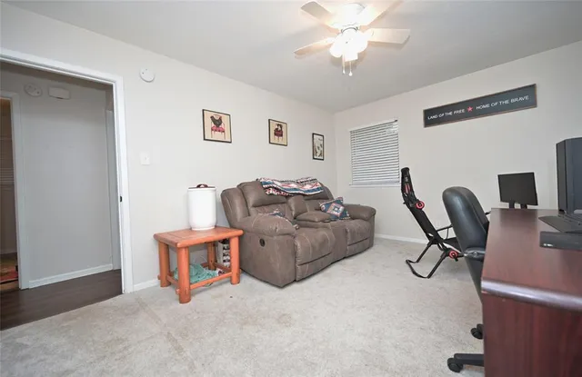 a bedroom with a couch and a window