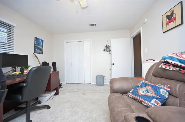 a work room with furniture and a window