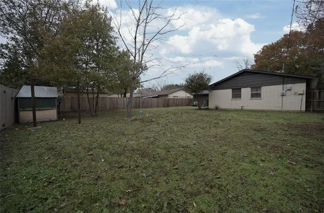 a backyard of a house with lots of green space
