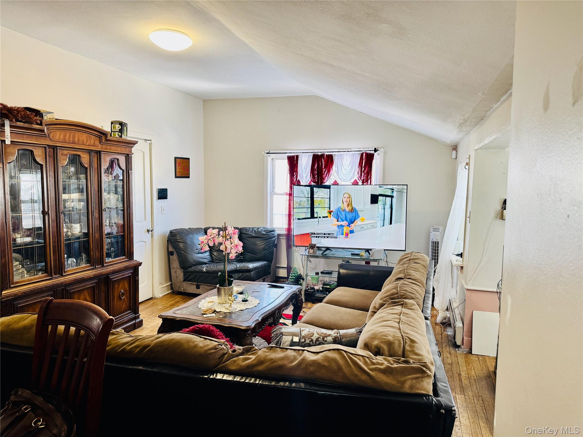 138 West Kingsbridge Road Mount Vernon, NY 10550 - Photo 3 of 6 a living room with furniture