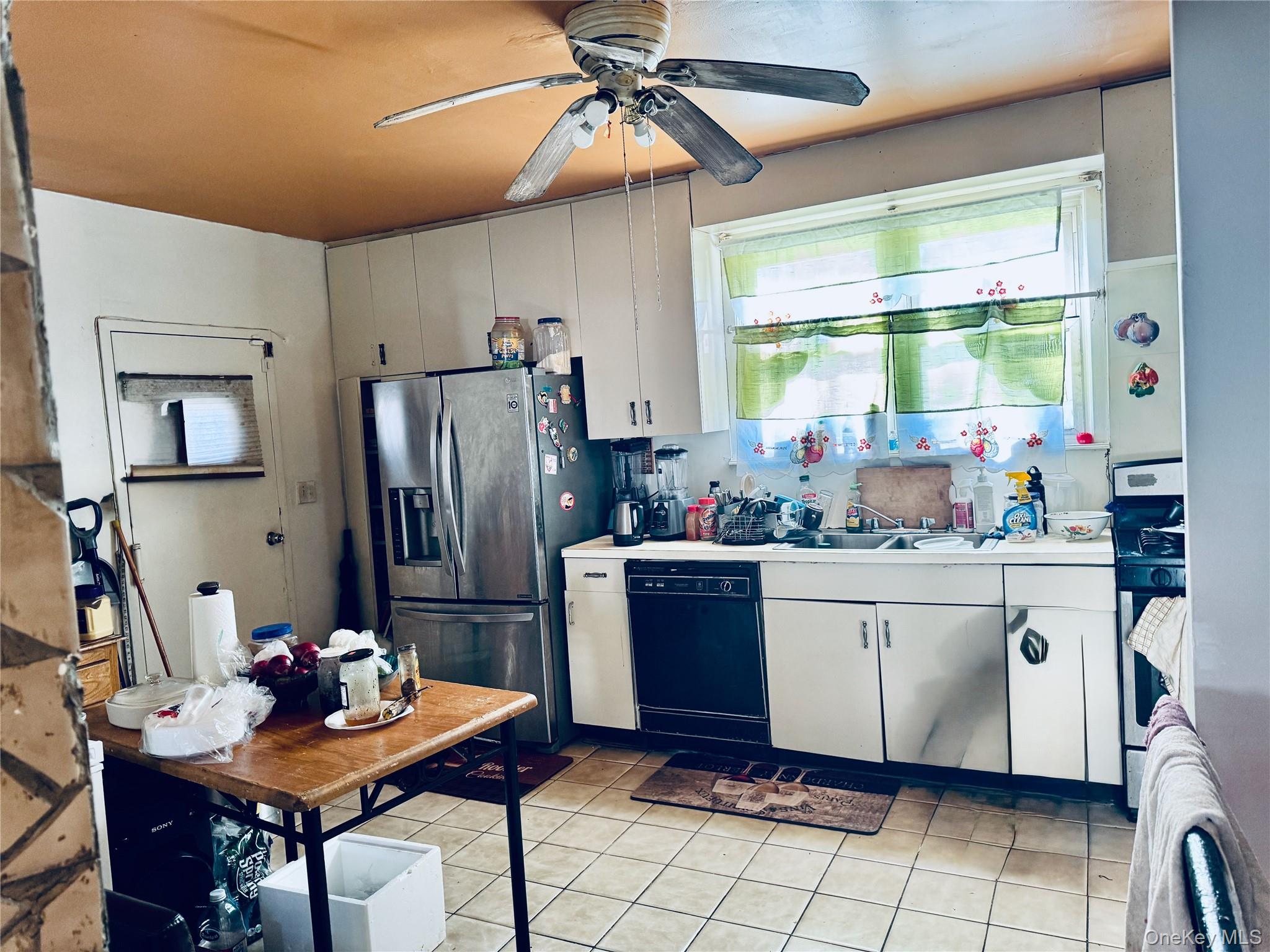 138 West Kingsbridge Road Mount Vernon, NY 10550 - Photo 5 of 6 a kitchen with stainless steel appliances granite countertop a refrigerator and a sink
